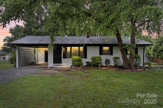 818 Stowe Ln, Gastonia, NC 28056 - single story home with gravel driveway, a front lawn, an attached carport, and a chimney