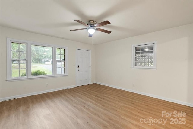818 Stowe Ln, Gastonia, NC 28056 - unfurnished room with light wood finished floors, ceiling fan, and baseboards