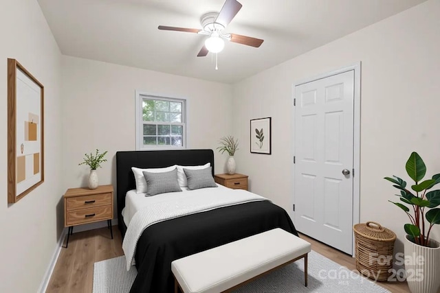 818 Stowe Ln, Gastonia, NC 28056 - bedroom with light wood-style floors, a ceiling fan, and baseboards
