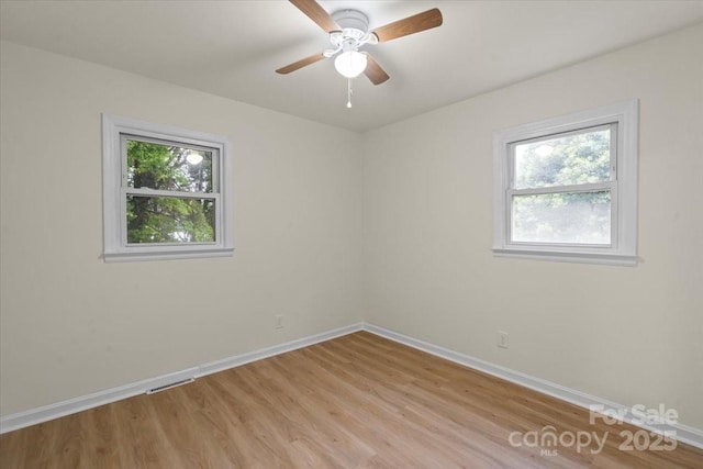 818 Stowe Ln, Gastonia, NC 28056 - spare room featuring baseboards, light wood-style floors, and ceiling fan