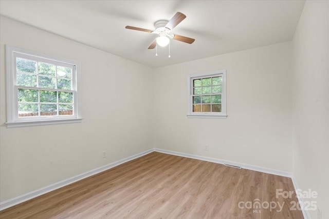 818 Stowe Ln, Gastonia, NC 28056 - unfurnished room with light wood-style flooring, baseboards, and ceiling fan