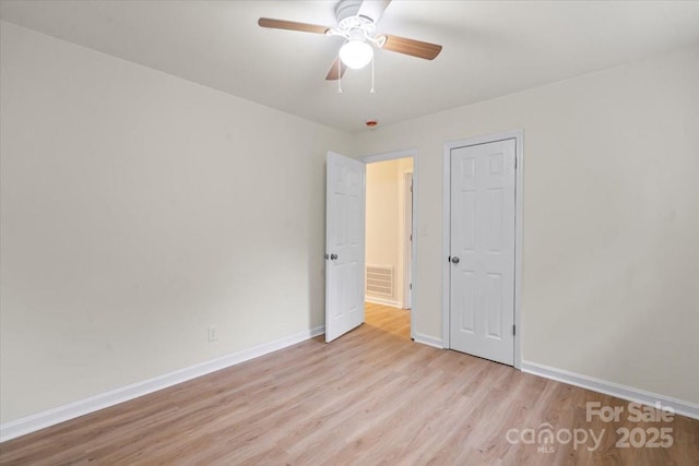 818 Stowe Ln, Gastonia, NC 28056 - unfurnished bedroom with light wood finished floors, baseboards, and ceiling fan