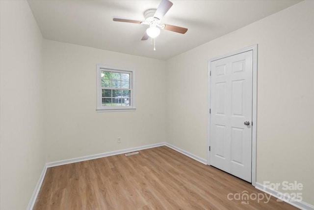 818 Stowe Ln, Gastonia, NC 28056 - unfurnished room featuring light wood-style flooring, ceiling fan, and baseboards