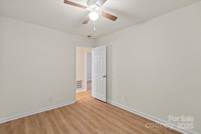818 Stowe Ln, Gastonia, NC 28056 - unfurnished room with light wood-style flooring, baseboards, and a ceiling fan
