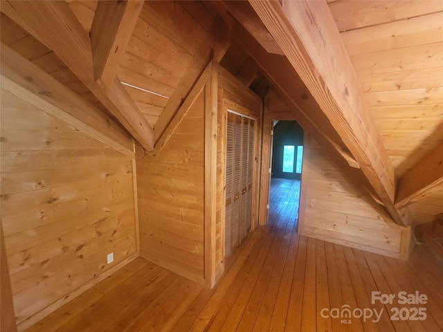 429 Biodome Dr, Waynesville, NC 28785 - additional living space with vaulted ceiling, hardwood / wood-style flooring, and wood walls