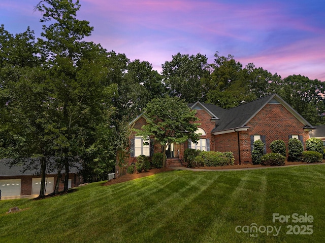10501 Mount Olive Estates Dr Unit 7, Mount Pleasant, NC 28124 - view of front of home featuring brick siding and a yard