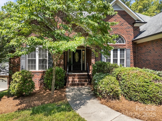 10501 Mount Olive Estates Dr Unit 7, Mount Pleasant, NC 28124 - property entrance featuring brick siding and roof with shingles