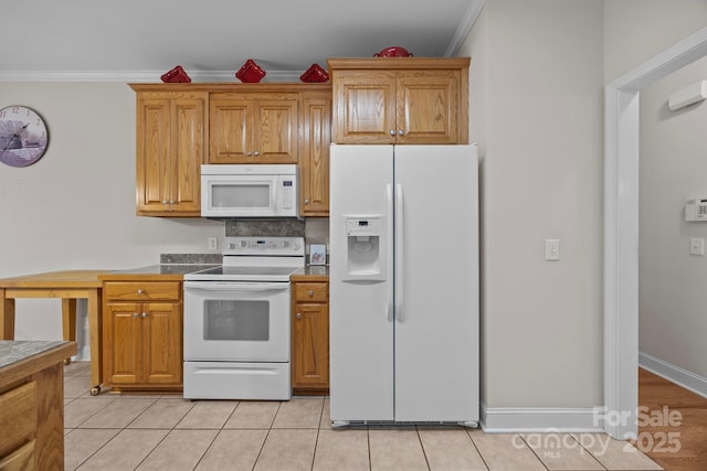 10501 Mount Olive Estates Dr Unit 7, Mount Pleasant, NC 28124 - kitchen featuring white appliances, crown molding, light tile patterned floors, and brown cabinets