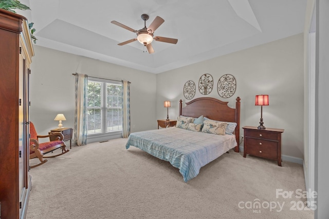10501 Mount Olive Estates Dr Unit 7, Mount Pleasant, NC 28124 - bedroom featuring a tray ceiling, light carpet, and ceiling fan