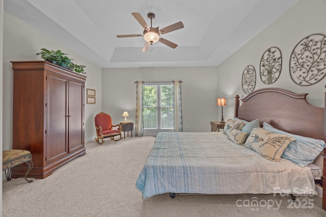 10501 Mount Olive Estates Dr Unit 7, Mount Pleasant, NC 28124 - bedroom with carpet flooring, a tray ceiling, a ceiling fan, and baseboards