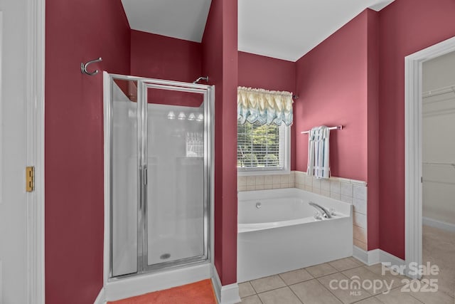 10501 Mount Olive Estates Dr Unit 7, Mount Pleasant, NC 28124 - full bath featuring a shower stall, a bath, tile patterned floors, and a spacious closet