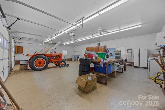 10501 Mount Olive Estates Dr Unit 7, Mount Pleasant, NC 28124 - garage with freestanding refrigerator and a garage door opener
