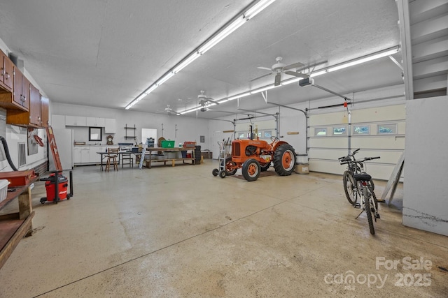 10501 Mount Olive Estates Dr Unit 7, Mount Pleasant, NC 28124 - garage with a ceiling fan and a garage door opener