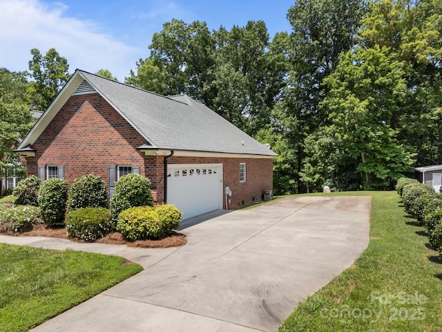 10501 Mount Olive Estates Dr Unit 7, Mount Pleasant, NC 28124 - view of home's exterior featuring a garage, brick siding, driveway, a yard, and a shingled roof
