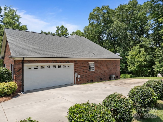 10501 Mount Olive Estates Dr Unit 7, Mount Pleasant, NC 28124 - view of property exterior featuring brick siding, a shingled roof, concrete driveway, and a garage