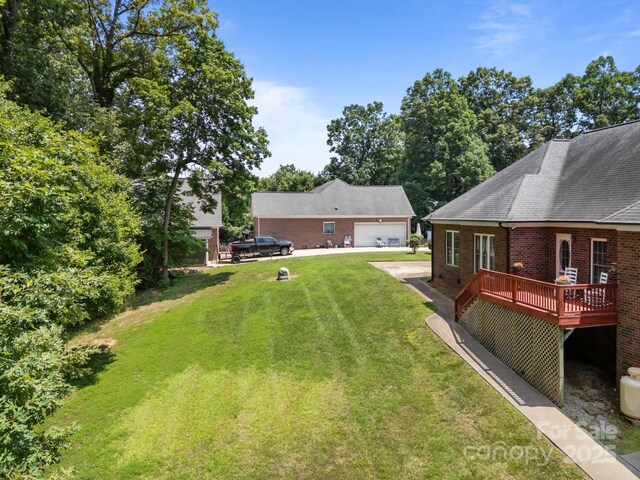 10501 Mount Olive Estates Dr Unit 7, Mount Pleasant, NC 28124 - view of grassy yard featuring a garage and a deck