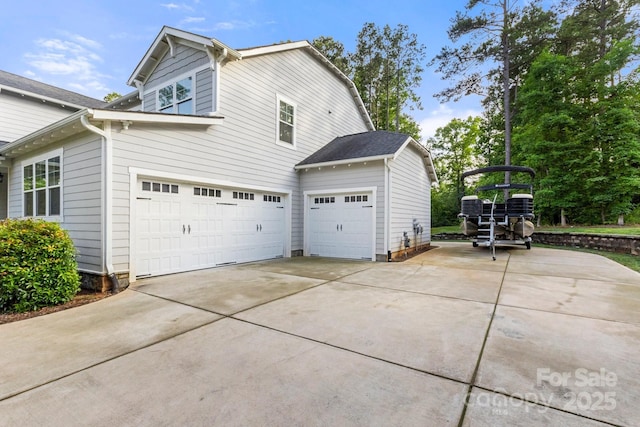 4189 Island Fox Ln, Denver, NC 28037 - view of side of property with concrete driveway and a garage