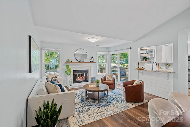 3308 Selwyn Farms Ln Unit 5, Charlotte, NC 28209 - living room with wood finished floors, lofted ceiling, and a glass covered fireplace