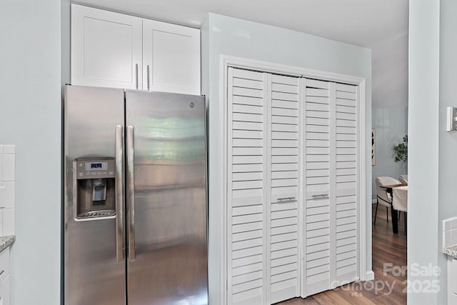 3308 Selwyn Farms Ln Unit 5, Charlotte, NC 28209 - kitchen featuring stainless steel fridge, white cabinetry, wood finished floors, and light stone countertops