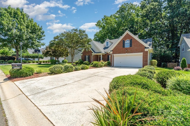 9419 Olivia Ln, Charlotte, NC 28277 - traditional-style house with brick siding, driveway, and an attached garage