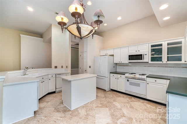9419 Olivia Ln, Charlotte, NC 28277 - kitchen with white appliances, backsplash, glass insert cabinets, white cabinets, and recessed lighting