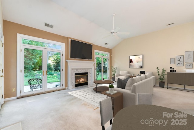 9419 Olivia Ln, Charlotte, NC 28277 - carpeted living room with a ceiling fan, a high end fireplace, and vaulted ceiling