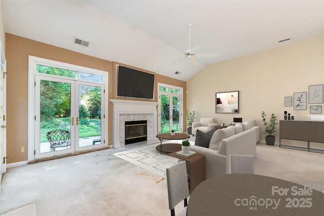 9419 Olivia Ln, Charlotte, NC 28277 - living room with carpet floors, a ceiling fan, lofted ceiling, and a fireplace