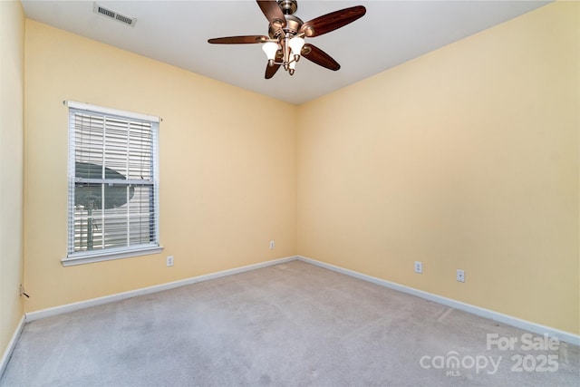 9419 Olivia Ln, Charlotte, NC 28277 - spare room featuring light carpet, ceiling fan, and plenty of natural light