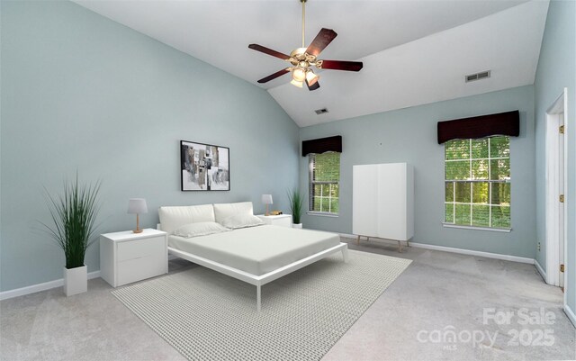 9419 Olivia Ln, Charlotte, NC 28277 - bedroom featuring light carpet, multiple windows, vaulted ceiling, and ceiling fan