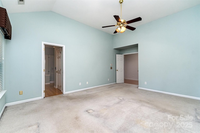 9419 Olivia Ln, Charlotte, NC 28277 - unfurnished bedroom featuring light carpet, connected bathroom, high vaulted ceiling, and ceiling fan