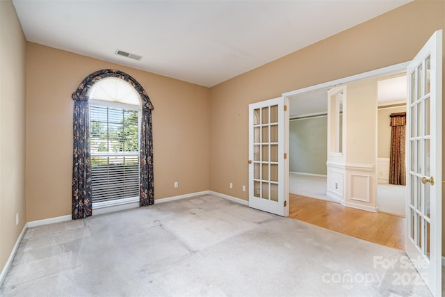 9419 Olivia Ln, Charlotte, NC 28277 - carpeted empty room featuring french doors