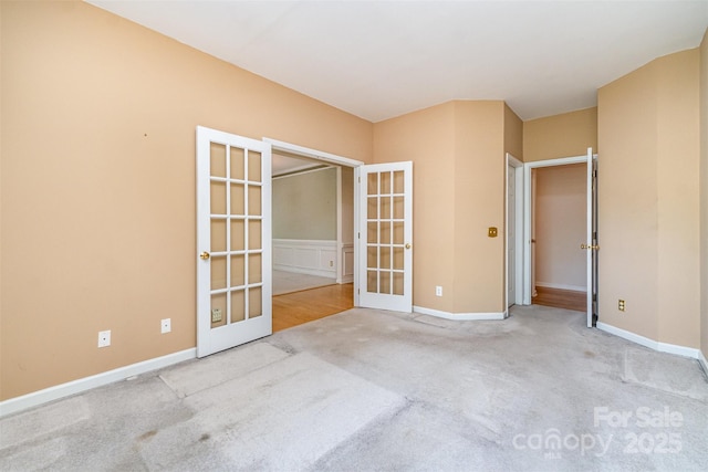 9419 Olivia Ln, Charlotte, NC 28277 - carpeted empty room featuring french doors and baseboards
