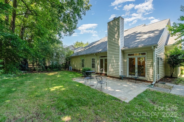 9419 Olivia Ln, Charlotte, NC 28277 - rear view of house featuring french doors, a yard, a patio, a chimney, and a shingled roof