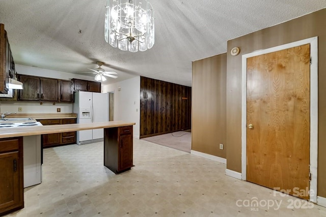 302 Mitchell Rd, Sylva, NC 28779 - kitchen with white refrigerator with ice dispenser, light floors, ceiling fan, light countertops, and a textured ceiling