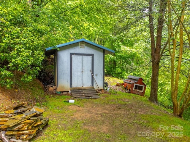 302 Mitchell Rd, Sylva, NC 28779 - view of shed with a forest view