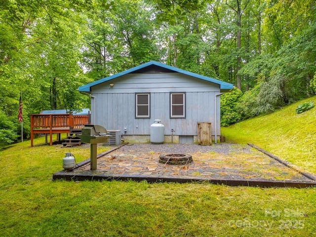 302 Mitchell Rd, Sylva, NC 28779 - back of house featuring an outdoor fire pit, a wooden deck, a yard, and cooling unit