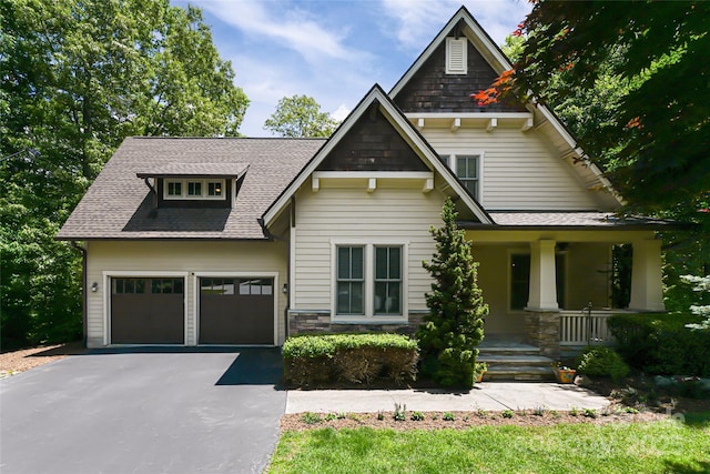 1 E Owl Creek Ln, Fairview, NC 28730 - craftsman inspired home featuring covered porch, driveway, an attached garage, and a shingled roof