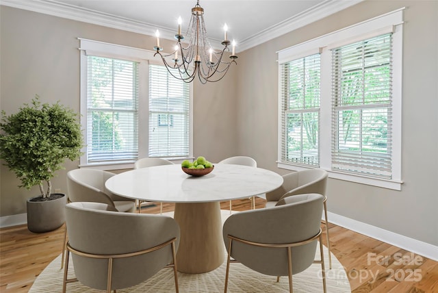 1 E Owl Creek Ln, Fairview, NC 28730 - dining room featuring healthy amount of natural light, crown molding, a chandelier, baseboards, and light wood finished floors