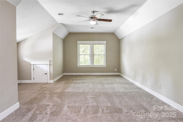 1 E Owl Creek Ln, Fairview, NC 28730 - additional living space with a ceiling fan, vaulted ceiling, carpet floors, baseboards, and a textured ceiling