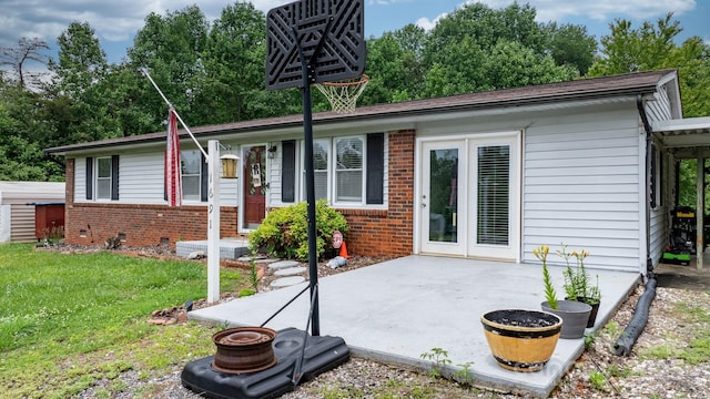 1691 Hill River Rd, Hiddenite, NC 28636 - view of front of property with brick siding, a patio, and a front lawn