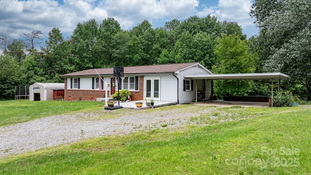 1691 Hill River Rd, Hiddenite, NC 28636 - ranch-style house with driveway, a front lawn, brick siding, and a carport