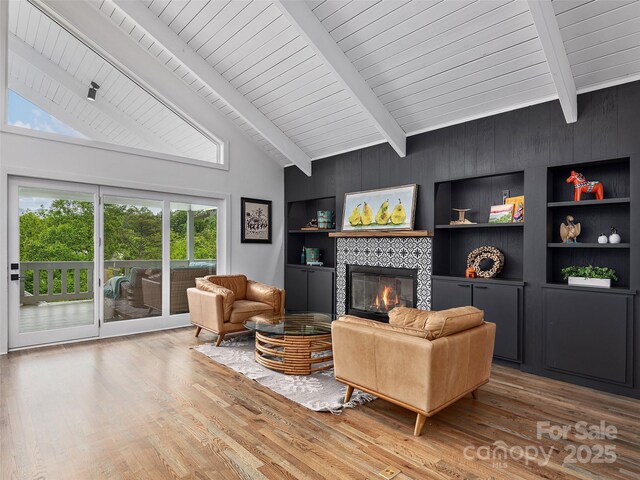 6 Lakeway Cir, Weaverville, NC 28787 - living room with healthy amount of natural light, a tiled fireplace, wood finished floors, high vaulted ceiling, and wood ceiling with exposed beams