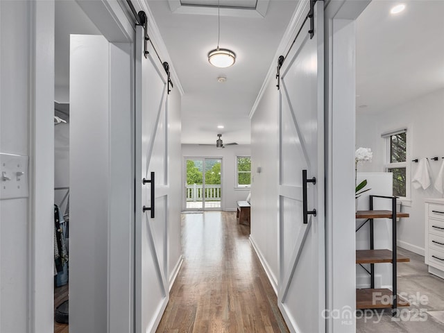 6 Lakeway Cir, Weaverville, NC 28787 - corridor featuring a barn door, wood finished floors, and baseboards