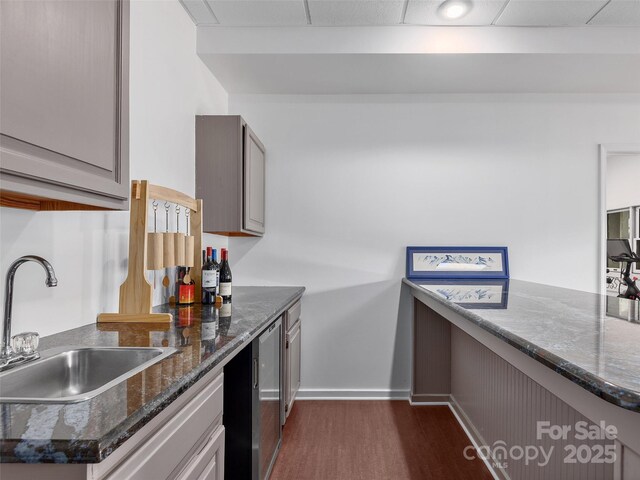 6 Lakeway Cir, Weaverville, NC 28787 - kitchen featuring a sink, dark wood-style floors, baseboards, and dark stone counters