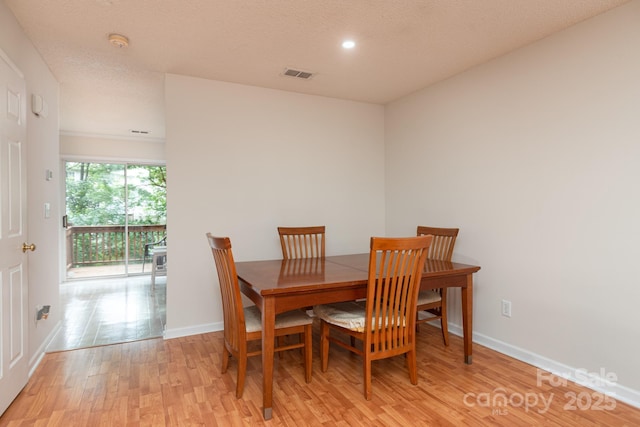10548 English Setter Way, Charlotte, NC 28269 - dining area featuring light wood-type flooring, baseboards, and recessed lighting