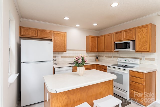 10548 English Setter Way, Charlotte, NC 28269 - kitchen featuring white appliances, crown molding, backsplash, light countertops, and a sink