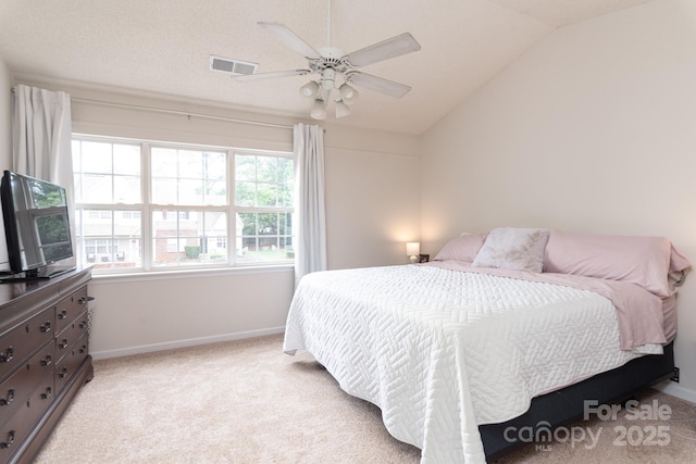 10548 English Setter Way, Charlotte, NC 28269 - bedroom with light colored carpet, baseboards, vaulted ceiling, and a ceiling fan