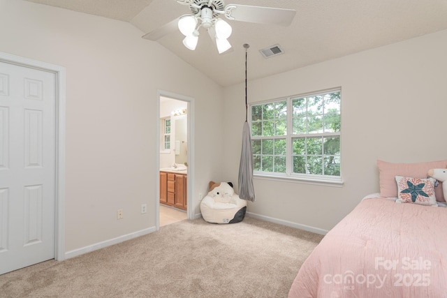 10548 English Setter Way, Charlotte, NC 28269 - bedroom with light colored carpet, baseboards, vaulted ceiling, ensuite bathroom, and a ceiling fan