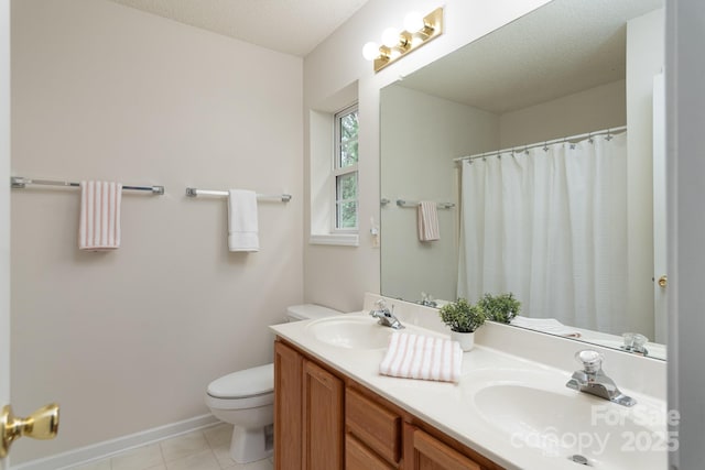 10548 English Setter Way, Charlotte, NC 28269 - bathroom featuring toilet, double vanity, tile patterned floors, baseboards, and a shower with shower curtain