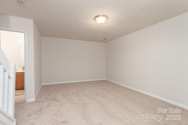 10548 English Setter Way, Charlotte, NC 28269 - unfurnished room featuring carpet floors, a textured ceiling, and baseboards